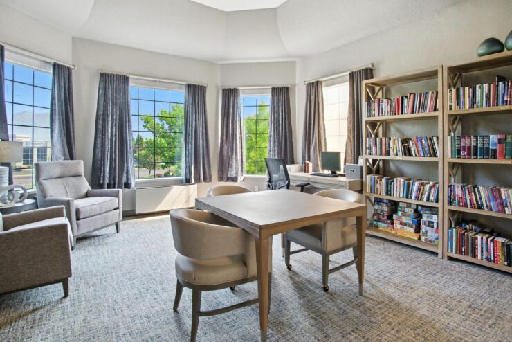 Bright and inviting space, featuring a reading nook and a communal table, fostering connection and comfort.