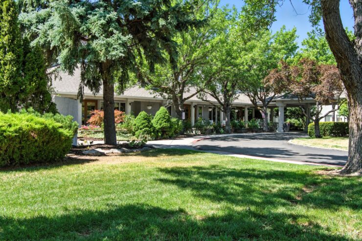 A welcoming community surrounded by lush greenery, inviting residents to enjoy a peaceful lifestyle.