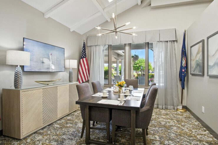 A welcoming dining area filled with light, fostering community and connection among residents.