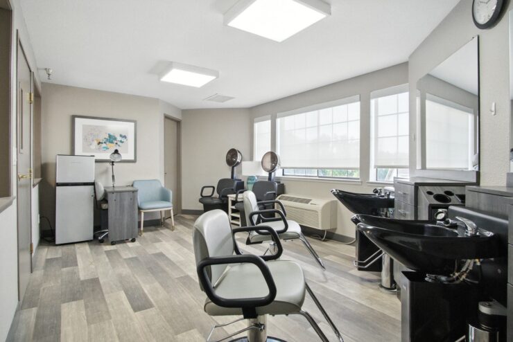 Bright and inviting salon space designed for relaxation and community engagement.