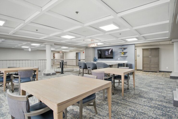 A welcoming common area with spacious tables, inviting decor, and a warm atmosphere for community gatherings.