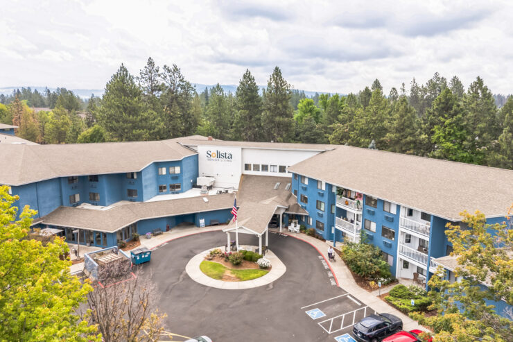 A welcoming retirement community surrounded by nature, fostering connection and comfort for all residents.