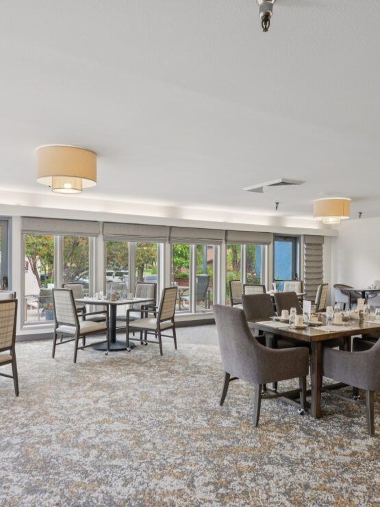 A welcoming dining area with elegant furnishings, inviting natural light, and a sense of community.
