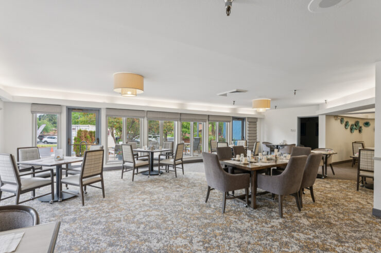 A welcoming dining area with elegant furnishings, inviting natural light, and a sense of community.
