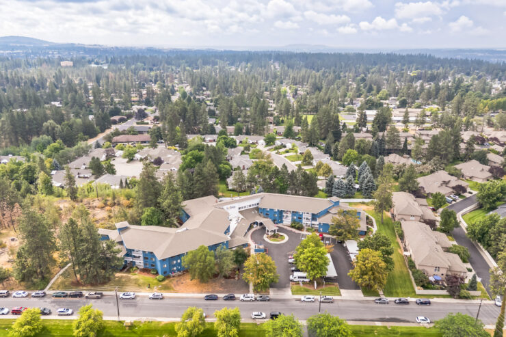 A welcoming community surrounded by lush greenery, offering a serene atmosphere for residents.