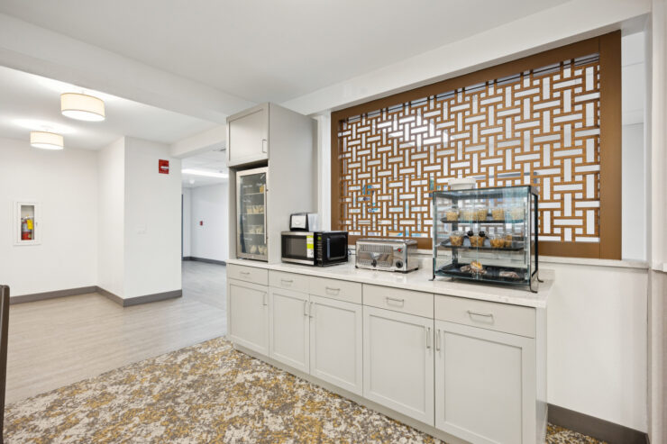 A bright, welcoming kitchen area invites residents to gather and share moments over refreshments.