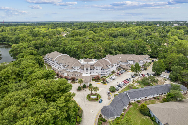 A welcoming community nestled among lush greenery, offering comfort and connection for all residents.