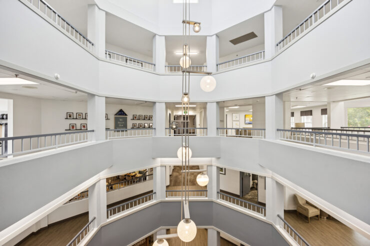 A vibrant, welcoming space featuring elegant architecture and communal areas for connection and relaxation.