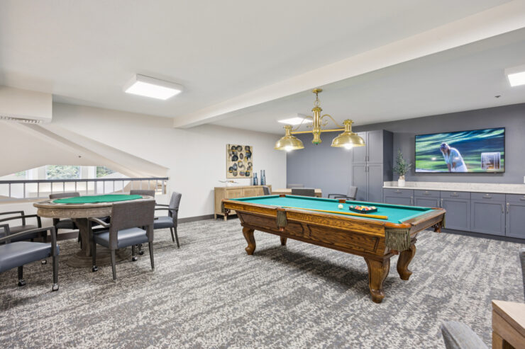 A vibrant game room inviting residents to enjoy leisure activities and foster community connections.