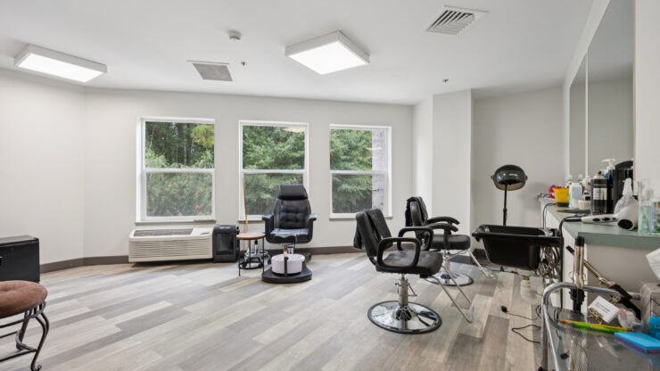 Bright and welcoming salon space, fostering community and relaxation for residents.