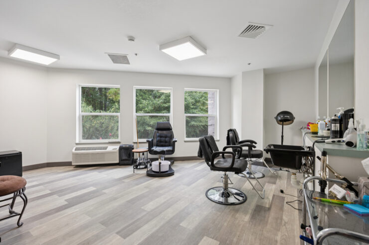 Bright and welcoming salon space, fostering community and relaxation for residents.