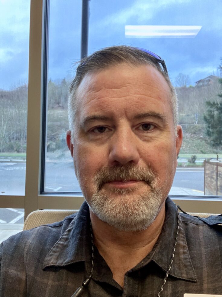 Warm and welcoming atmosphere, showcasing a friendly individual in a serene, community-oriented setting.