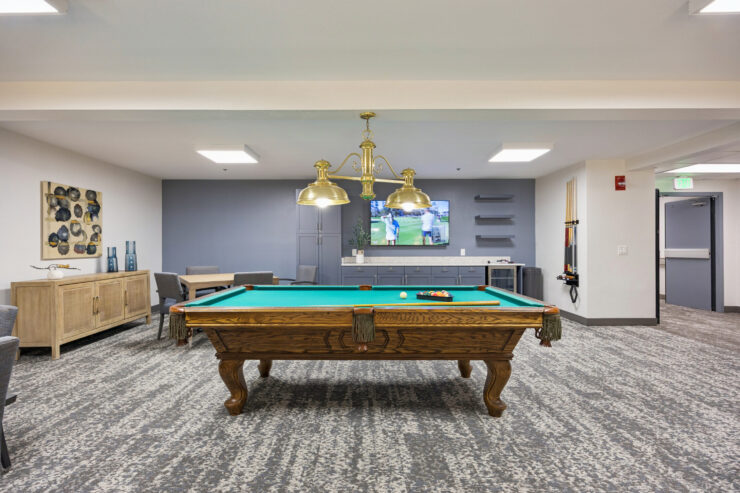 A welcoming game room featuring a classic pool table, perfect for socializing and relaxation.