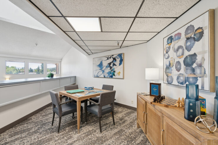 A bright, inviting space featuring a dining table, comfortable seating, and cheerful decor, perfect for gatherings.