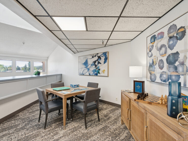 A bright, inviting space featuring a dining table, comfortable seating, and cheerful decor, perfect for gatherings.