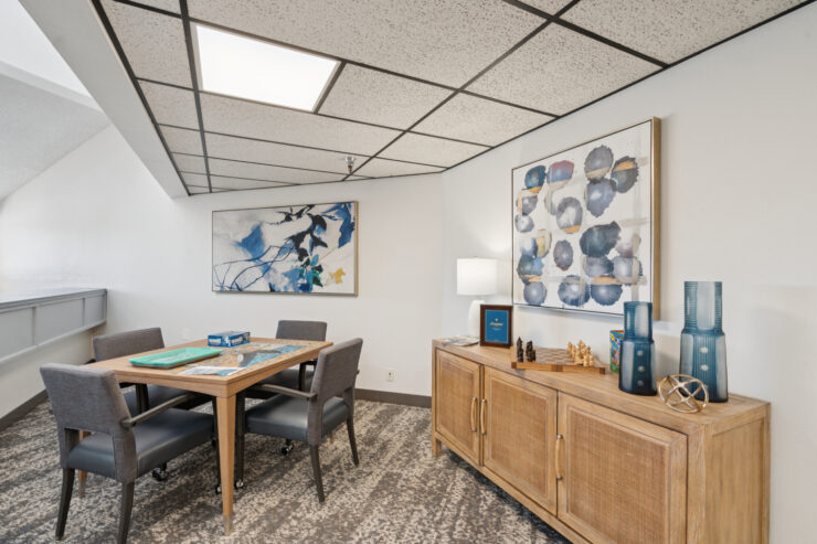 A welcoming space designed for connection, featuring comfortable seating and vibrant artwork.
