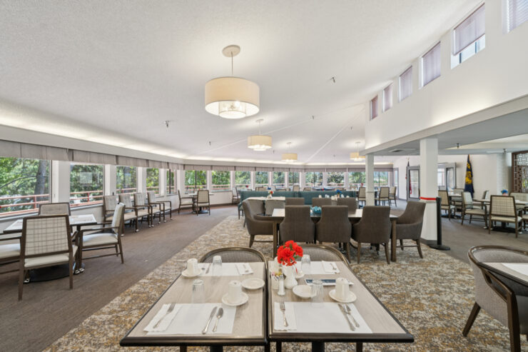 Bright, inviting dining area with elegant seating, perfect for community gatherings and shared meals.