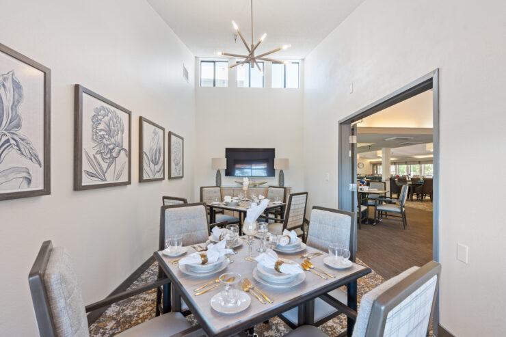 An inviting dining area, beautifully set for meals, promoting warmth and community among residents.
