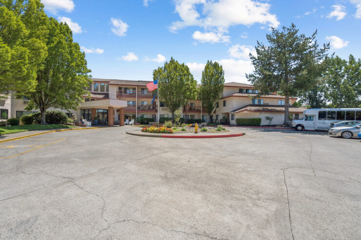 Welcoming grounds with vibrant landscaping, inviting residents to connect in a serene community atmosphere.