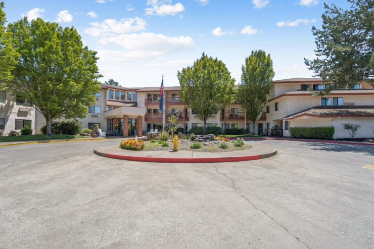 A welcoming community surrounded by lush greenery, inviting residents to enjoy a vibrant lifestyle.