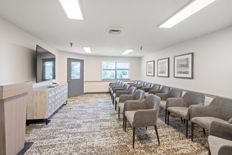A welcoming lounge with comfortable seating, inviting natural light, and a warm, community-focused atmosphere.