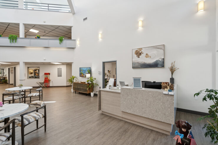 A welcoming reception area filled with natural light, promoting community and comfort for all residents.