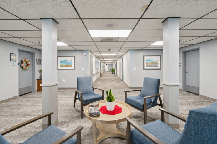 A welcoming lounge area encourages connection, featuring comfortable seating and vibrant decor.