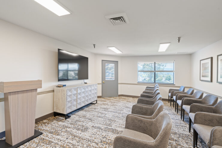 A welcoming meeting space with comfortable seating, natural light, and a warm atmosphere for community gatherings.