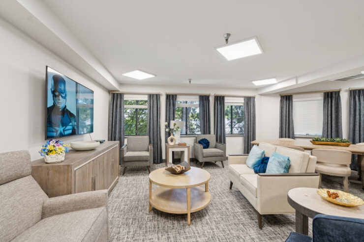 A welcoming lounge with comfortable seating, bright natural light, and a serene atmosphere for community gatherings.