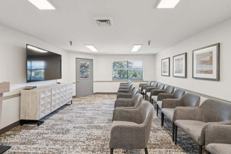 Bright, inviting space with comfortable seating, fostering community and connection among residents.