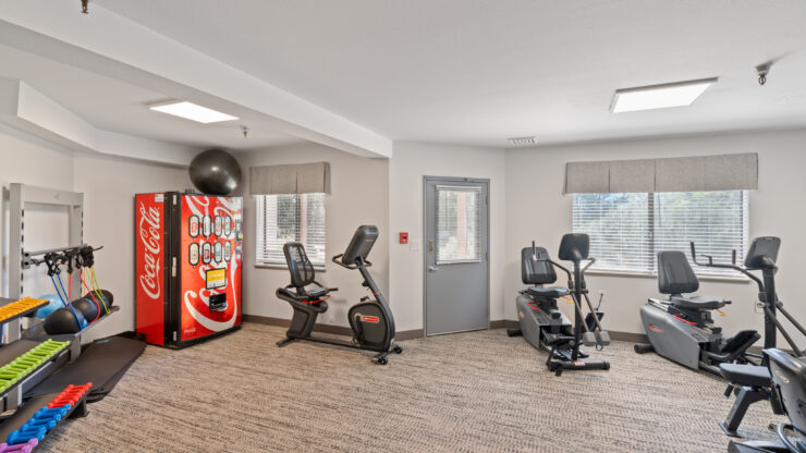 A vibrant fitness area filled with equipment, inviting residents to stay active and engaged.