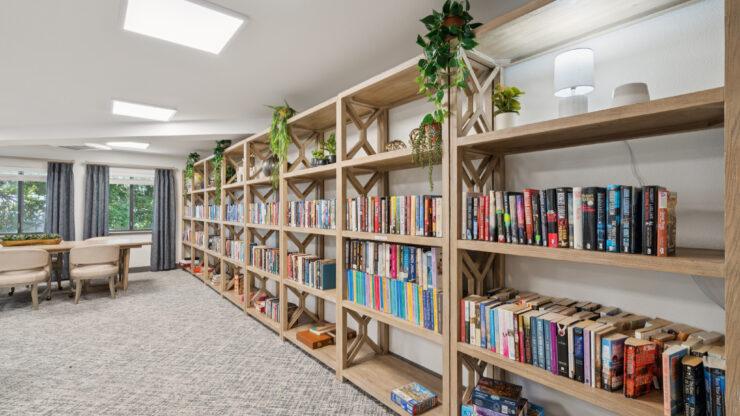 A welcoming library filled with books, inviting residents to connect, relax, and share stories.