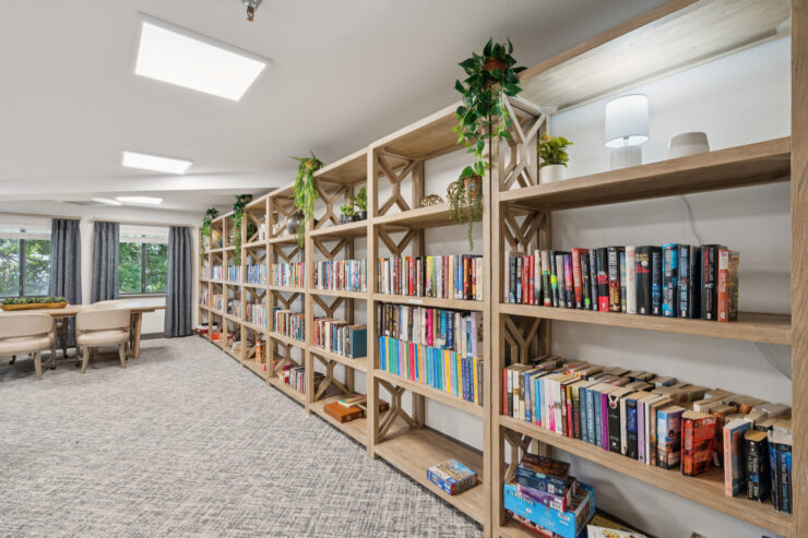 A welcoming library filled with books, inviting residents to connect, relax, and share stories.