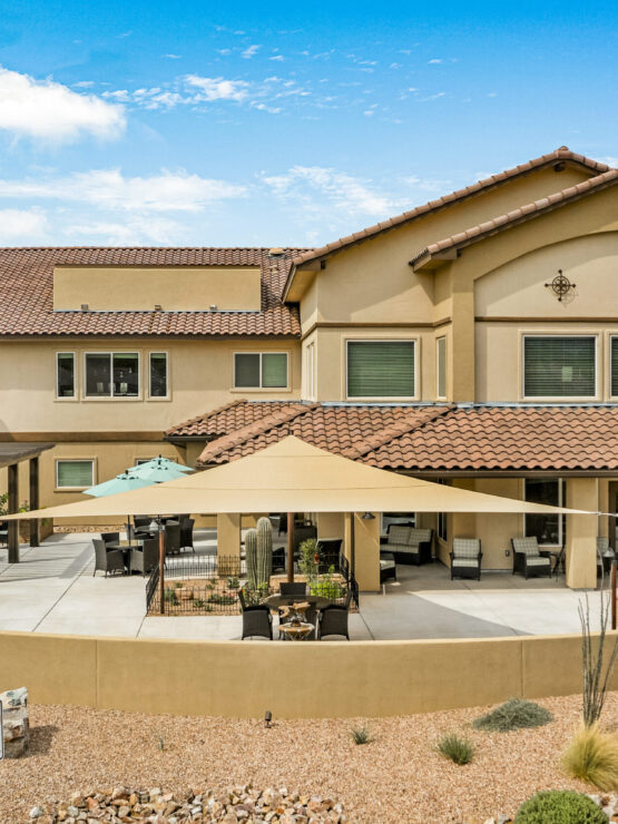 A welcoming retirement community surrounded by beautiful landscaping and inviting outdoor spaces.