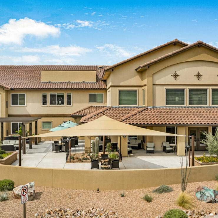 A welcoming retirement community surrounded by beautiful landscaping and inviting outdoor spaces.