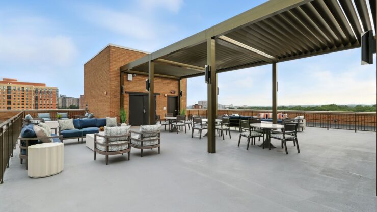 A welcoming rooftop space with comfortable seating, perfect for socializing and enjoying serene views.
