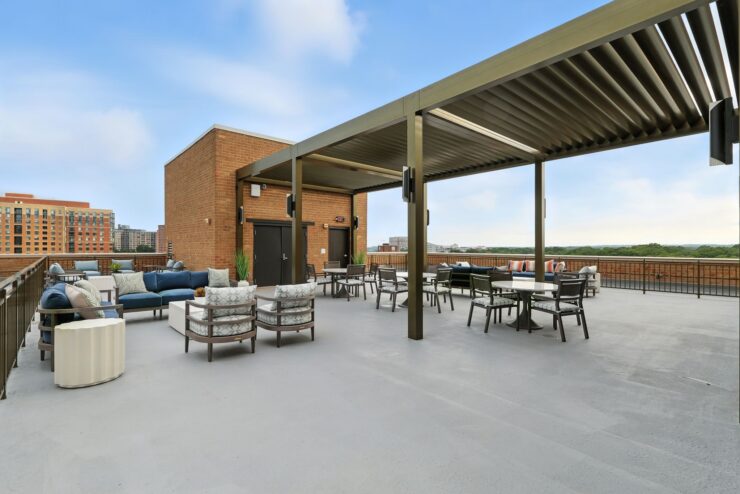 A welcoming rooftop space with comfortable seating, perfect for socializing and enjoying serene views.