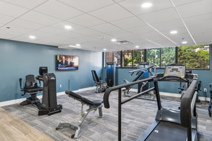 A welcoming fitness area filled with natural light, encouraging community wellness and active living.