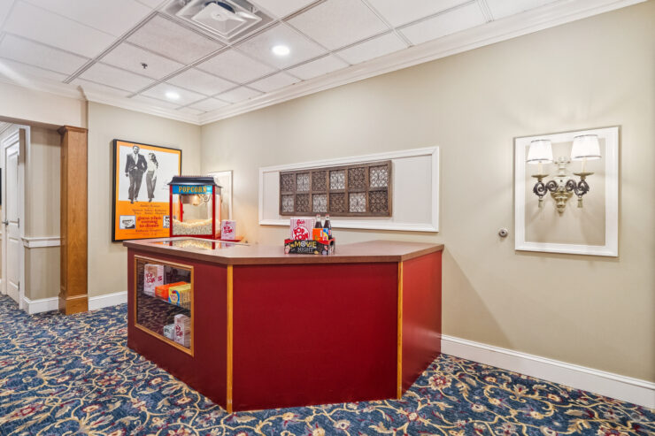 A welcoming space featuring a vibrant popcorn stand, inviting residents to enjoy movie nights together.