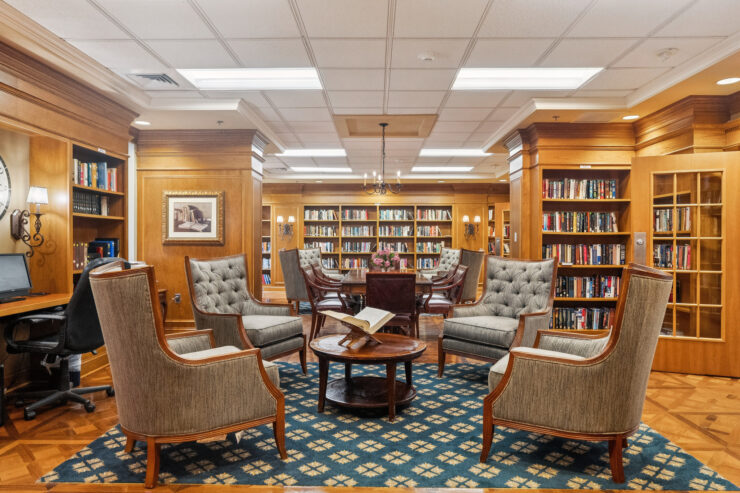 A welcoming library filled with comfortable seating and shelves of books, perfect for community gatherings.