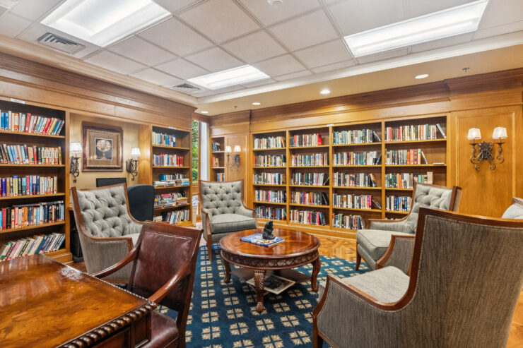 A welcoming library space with plush seating, inviting warmth, and shelves filled with books for community enjoyment.