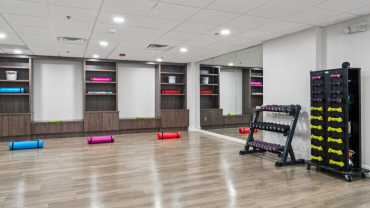 A bright, inviting fitness space with colorful equipment, perfect for community wellness activities.
