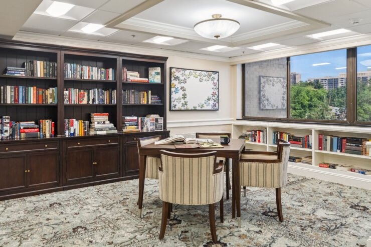A welcoming reading nook with comfortable seating and a vibrant bookshelf, perfect for community gatherings.