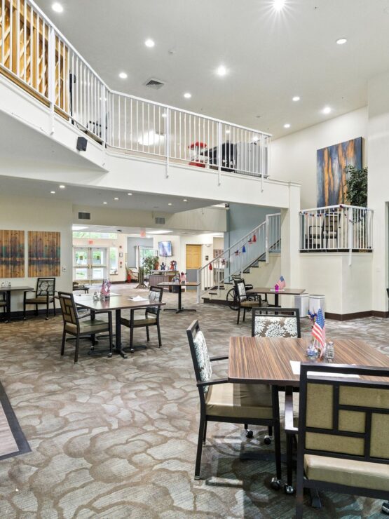 A welcoming common area with bright lighting, spacious seating, and a sense of community and warmth.