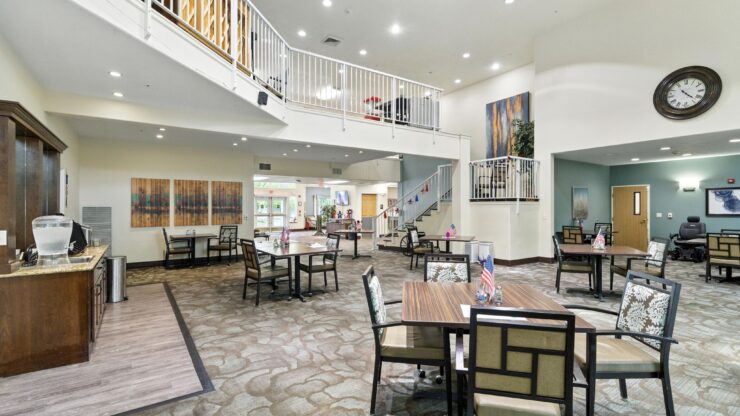 A welcoming common area with bright lighting, spacious seating, and a sense of community and warmth.