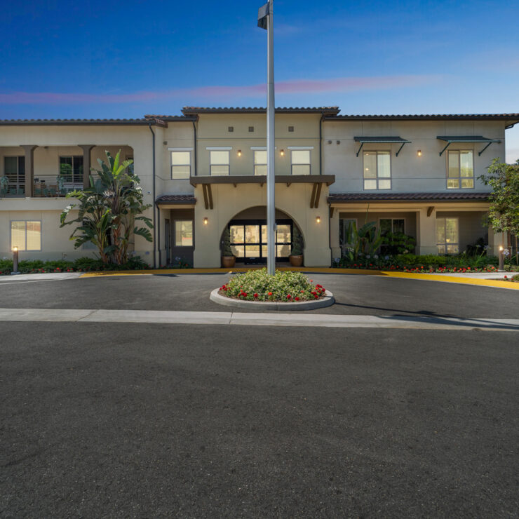 A welcoming entrance surrounded by vibrant landscaping, inviting a sense of community and comfort.