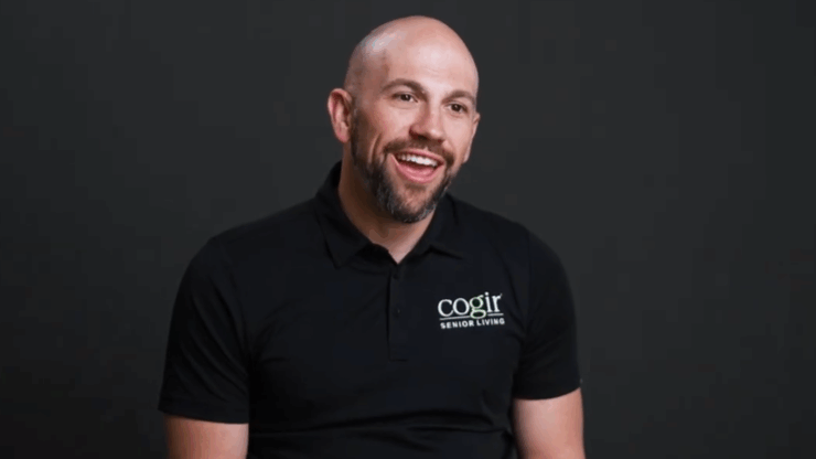 A warm and engaging representative shares insights, reflecting community spirit and care.