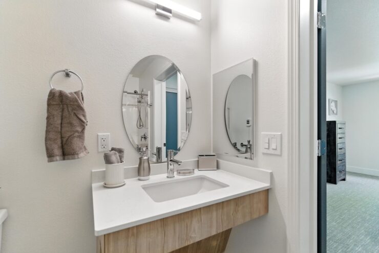 A bright, inviting bathroom with modern fixtures, promoting comfort and ease for all residents.