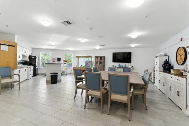A bright, inviting communal space with a large dining table, perfect for gatherings and shared meals.