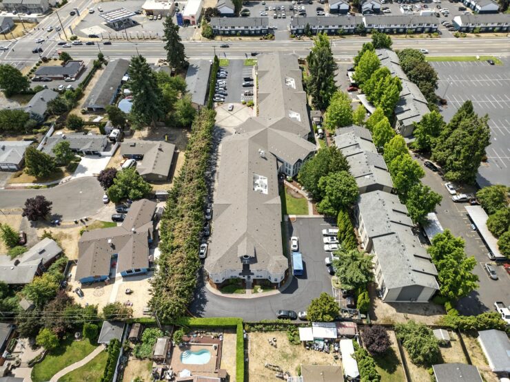 A welcoming community surrounded by lush greenery, offering comfort and connection for residents.